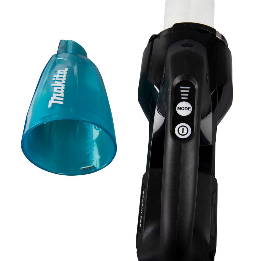 MAKITA Varsi-imuri XGT. Lähikuvassa varsi-imurin käynnistyskytkin. Säiliö irrotettuna.