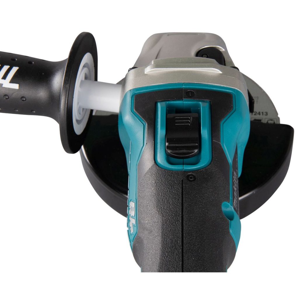 MAKITA Kulmahiomakone LXT. Lähikuvassa Kulmahiomakone LXT:n käyttökytkin.