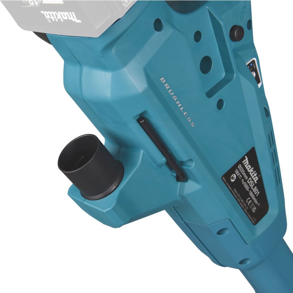 MAKITA Varsihiomakone LXT. Lähikuvassa Varsihiomakone LXT:n imuriliitäntä.