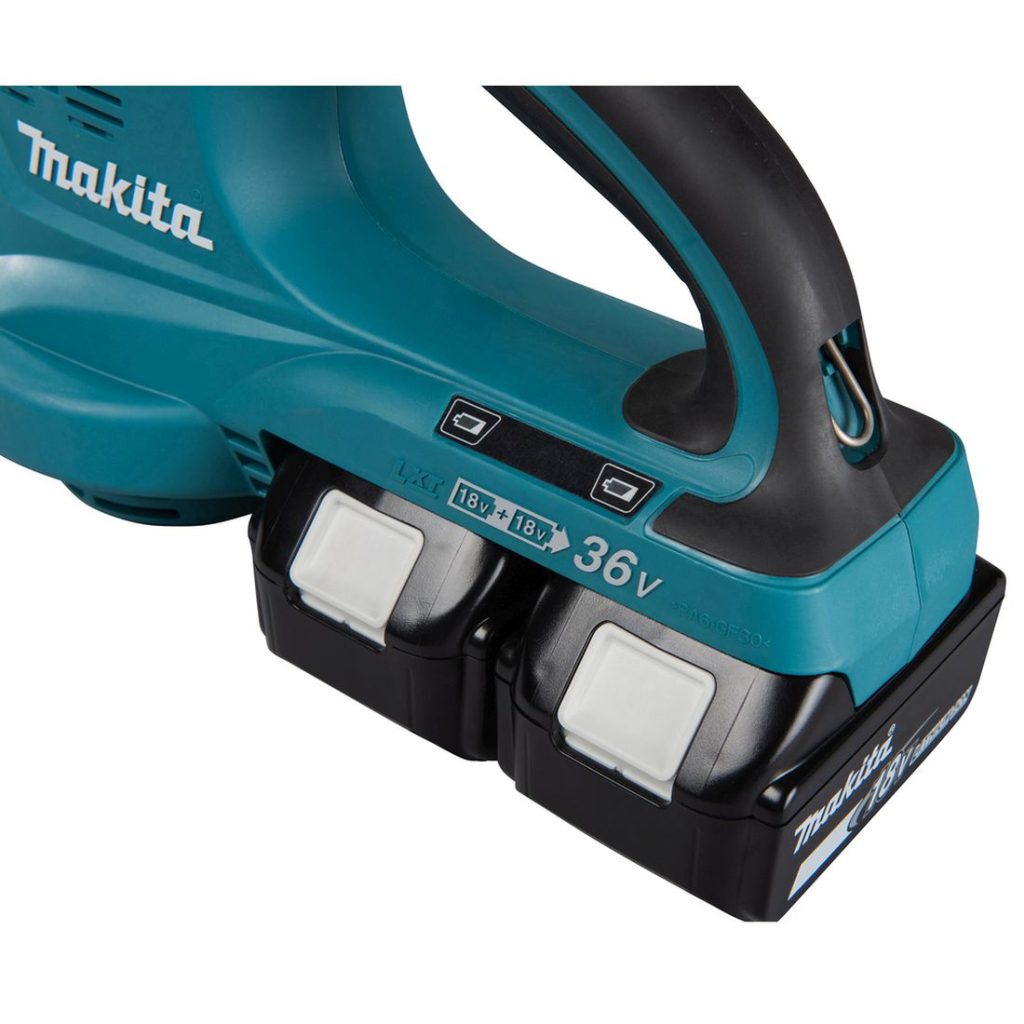 MAKITA Puhallin LXT. Lähikuvassa kaksi akkua kiinnitettynä puhaltimeen.