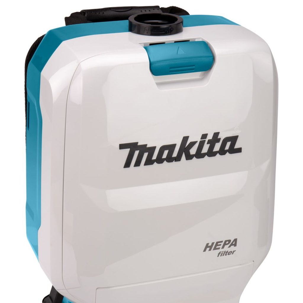 MAKITA Reppuimuri LXT. Lähikuvassa Reppuimuri LXT:n pölypussin luukku suljettuna.