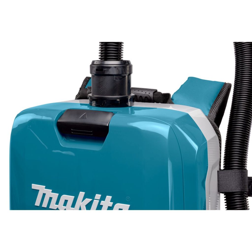 MAKITA Reppuimuri LXT. Lähikuvassa Reppuimuri LXT:n pölysäiliön luukun kahva luukku suljettuna.