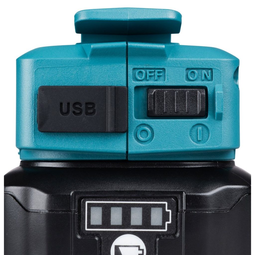 MAKITA Akkuadapteri CXT. Lähikuvassa Akkuadapteri CXT:n USB-liitäntä ja virtakytkin.