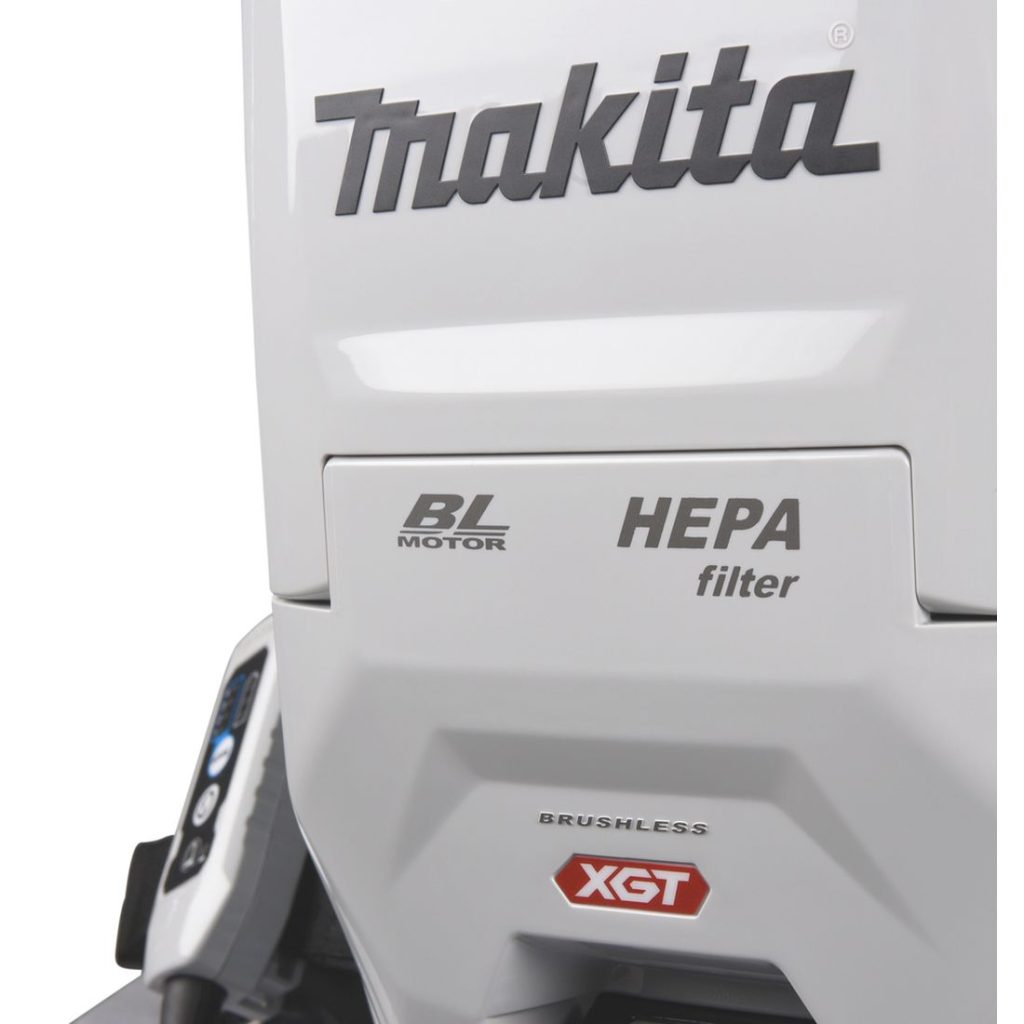 MAKITA Reppuimuri XGT. Lähikuvassa Reppuimuri XGT:n pölysäiliön luukku kiinni.