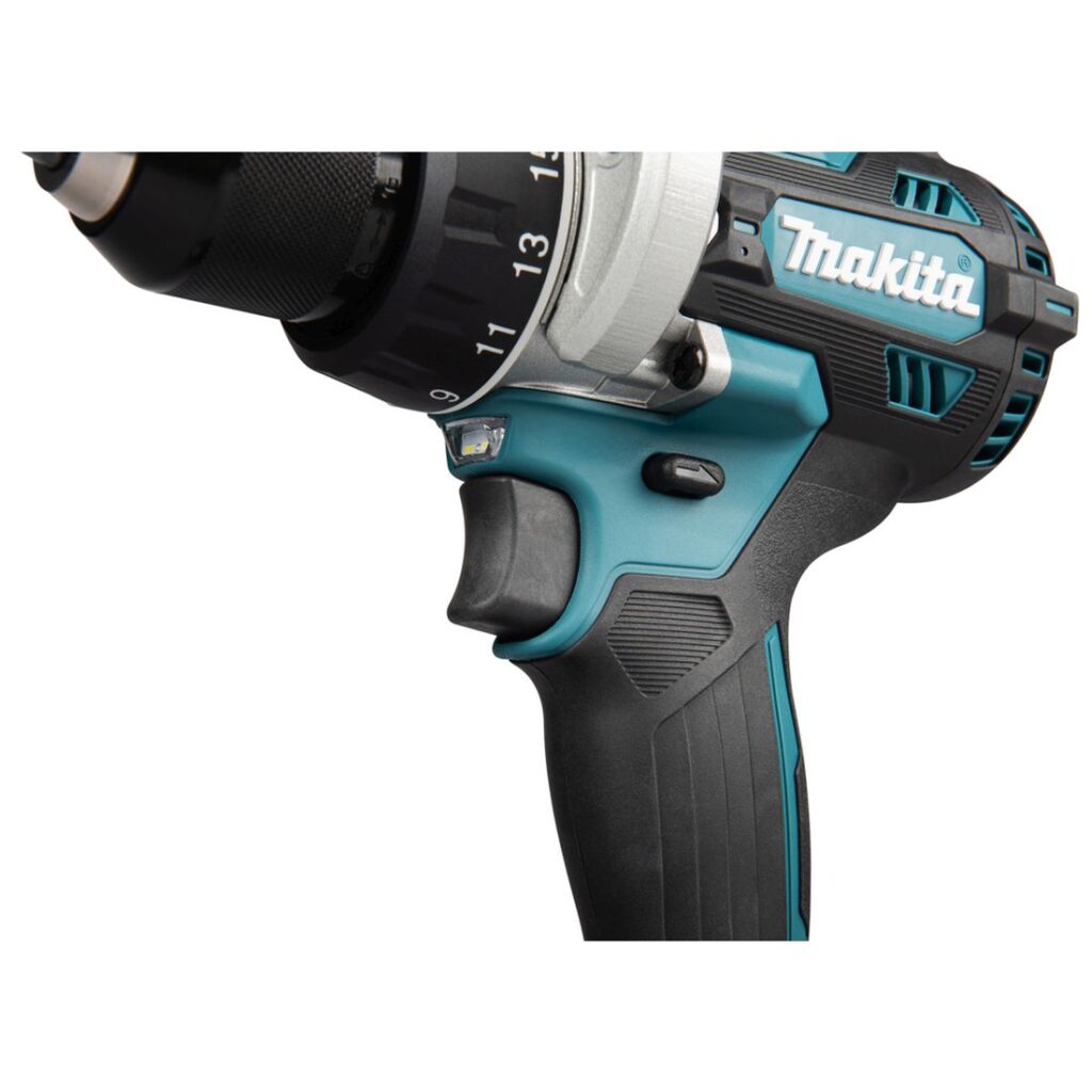 MAKITA Porakone LXT. Lähikuvassa porakone LXT:n liipaisin oikealta etuviistosta.