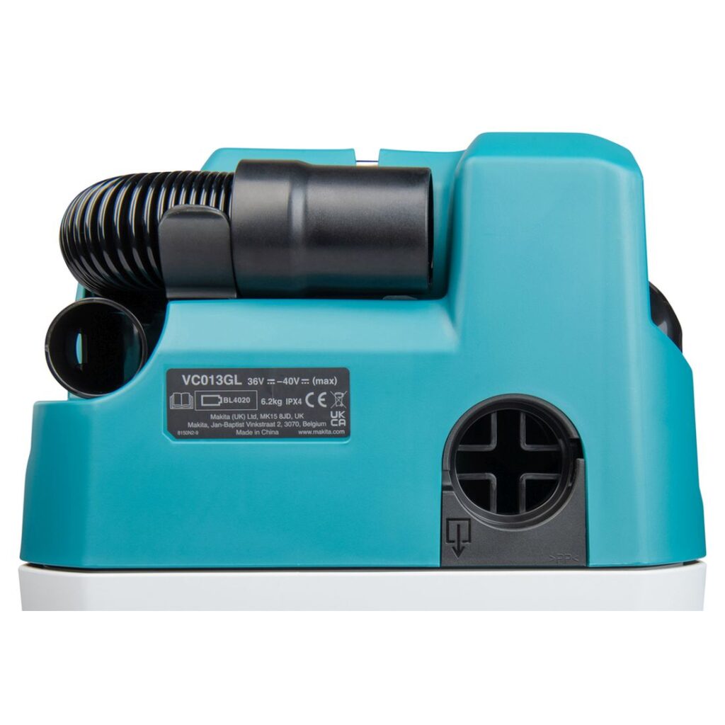 MAKITA Akkuimuri XGT. Lähikuvassa imuletkun säilytyspaikka.