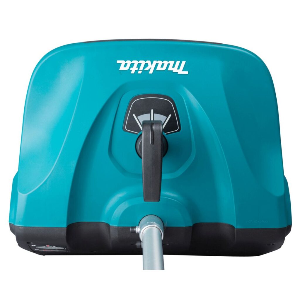 MAKITA Lumilapiolisälaite SN400MP. Lähikuvassa Lumilapiolisälaite SN400MP:n heittosuunan vipu vasemmalta ylhäältäpäin.